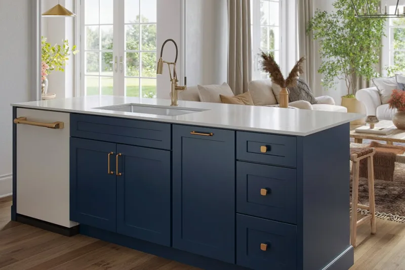 Deep blue shaker island with brass hardware and a white quartz countertop